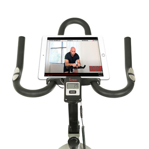 DEVICE HOLDER | Place your device above the digital monitor and start your workout routine by watching your favorite online training videos by Sunny Health & Fitness.